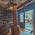 Hotel Canto del Mar in La Serena wine cellar with bottle racks and open door to outdoor terrace