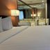 Baymont by Wyndham Plainfield/ Indianapolis Arpt Area guest room with king bed and mirrored wall