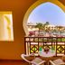 Charmillion Club Resort in Sharm el-Sheikh with arched balcony view of pool and palm gardens