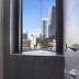 Surfers Plaza Resort, Surfers Paradise: bathroom window with city skyline and high-rise view