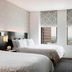 Renaissance Cincinnati Downtown Hotel guest room with two beds and city views through large windows