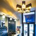 The Lift Boutique Hotel by Ridan Hotels lobby in Lisbon with front desk, chandelier and glass entrance