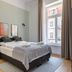 limehome Baden-Baden Bäderstraße room with double bed, bedside tables and large window in Baden-Baden