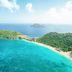 Cheval Blanc St-Barth in Gustavia with turquoise bay, sandy beach, and lush green islands