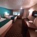 Howard Johnson by Wyndham Woodstock NB room with two beds, desk and window view in Woodstock