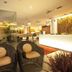 Extreme Boutique Hotel, Kluang: modern lobby with wicker chairs, front desk, and warm ambient lighting