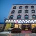 Jeju Stay Hotel in Jeju City exterior with lit entrance and windowed facade
