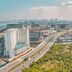 Kingsford Hotel Manila Bay in Manila with city skyline, highway, and green landscape view