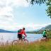 Rauland Høgfjellshotell in Rauland with cyclists riding beside a lake and mountains