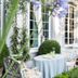 B&B The Verhaegen in Ghent courtyard garden with table and chairs beside tall windows