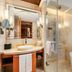New Century Hotel Pudong Shanghai bathroom with double vanity, glass shower and freestanding tub in Shanghai