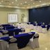 Hb Córdoba meeting room set with tables, blue tablecloths, chairs and presentation screen