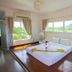 The Breath Khao Yai in Mu Si guest room with large windows and mountain views