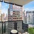 Mantra Southbank Melbourne balcony with city skyline and neighboring high-rise buildings