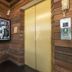 Suneta Hostel Khaosan in Bangkok hallway with elevator and wooden walls
