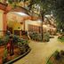 Hotel Mahabs in Mahabalipuram with a lit garden pathway and tropical landscaping at night