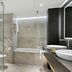 Hilton Munich Airport bathroom in Munich with glass shower, soaking tub and double sinks