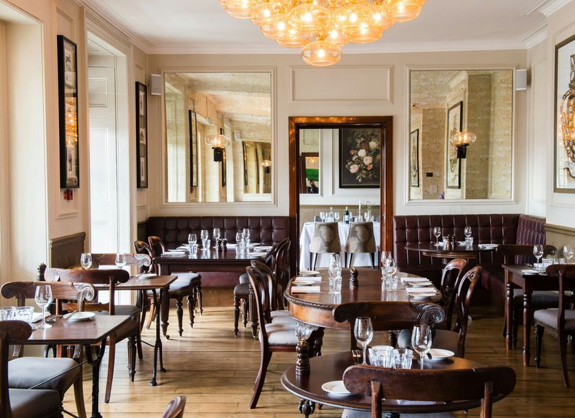 Hotel Du Vin & Bistro Tunbridge Wells dining room in Royal Tunbridge Wells with tables, chairs and chandelier