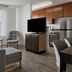 TownePlace Suites by Marriott Ontario Airport suite with kitchen, TV and seating area in Rancho Cucamonga
