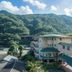 Hakonenomori Okada in Hakone with mountain views and a green-roofed building surrounded by trees