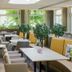 Seetelhotel Ostseehotel Ahlbeck in Heringsdorf dining lounge with curved banquette seating and large windows