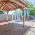 Super 8 by Wyndham Houghton Lake outdoor picnic shelter beside a children's playground