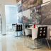Hotel Santiago, Praia: bright dining area with wall photo collage and glass doors to a balcony