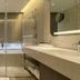 Monarch Plaza Hotel in Taoyuan City bathroom with glass shower, double vanity, and soaking tub