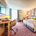 Leonardo Hotel Wolfsburg City Center room with twin beds, desk and sitting area in Wolfsburg