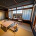 Ryokan Ryokufuso in Kyoto: traditional tatami room with low table, cushions, and shoji windows