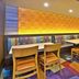 Fairfield Inn & Suites by Marriott Madison West/Middleton dining area in Middleton with colorful chairs and booths