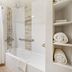 Best Western East Zion Thunderbird Lodge bathroom with tub-shower and towel shelves in Mount Carmel
