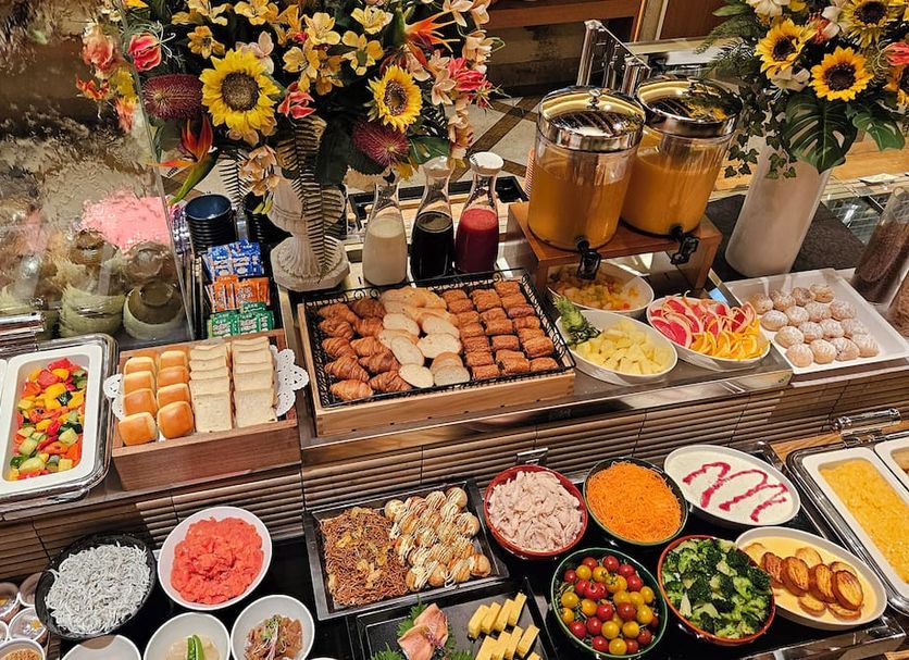 Hearton Hotel Kitaumeda in Osaka breakfast buffet with eggs, fruit, pastries, and juices