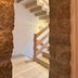 Hôtel confidentiel Le Grecale staircase framed by stone walls in Pianottoli-Caldarello