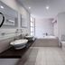 Melia Tortuga Beach Santa Maria bathroom with double sinks, bathtub, toilet and glass shower