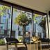 Twin Peaks Hotel in San Francisco lobby seating area with large windows and street view