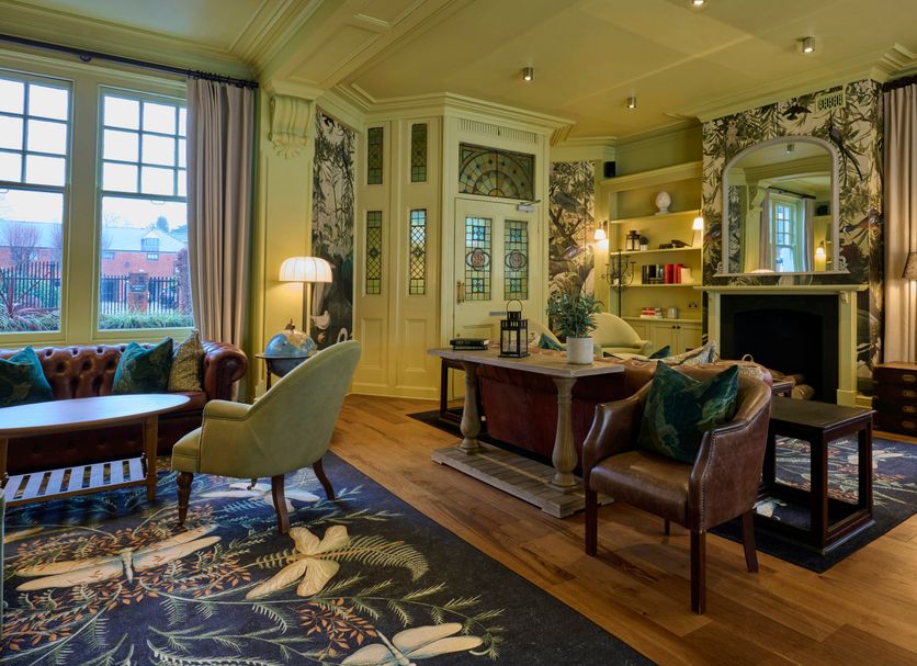 Hotel du Vin Henley in Henley-on-Thames lounge with fireplace, large windows and patterned rugs