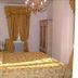 Masseria Magli Resort in Martina Franca, bedroom with ornate bed, chandelier, curtains and wardrobe