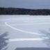 Kiwassa Lake Bed & Breakfast in Saranac Lake with snowy lake and tree shadows