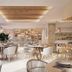 Bordoy Alcudia Bay dining area in Alcúdia with bright tables, woven chairs and open buffet display