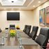 Home2 Suites by Hilton Salt Lake City/Layton meeting room with conference table and wall-mounted TV