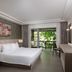 Pp Princess Resort room in Ko Phi Phi with king bed and balcony overlooking greenery