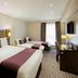 Premier Inn Norwich East - Broadlands/A47 bedroom with two beds, desk and window light in Norwich