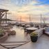 Hacienda del Mar Los Cabos oceanfront terrace with fire pit seating at sunset in Cabo San Lucas
