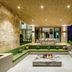 Kaya Palazzo Golf Resort Belek outdoor lounge with fire pit, poolside seating and illuminated terrace