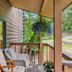Deer Harbor Inn in Deer Harbor porch with chairs and hanging flowers overlooking trees