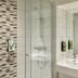 Premier Inn Glasgow - Paisley bathroom with glass shower, sink and large mirror in Paisley