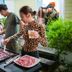 The Jungle House, Hengchun Township: guests grilling meat at an outdoor barbecue area