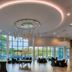 Sheraton Eatontown Hotel in Eatontown ballroom with large windows and modern circular ceiling lights