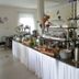 Hotel Ackermann in Riedstadt breakfast buffet with pastries, fruit, coffee urn and plants